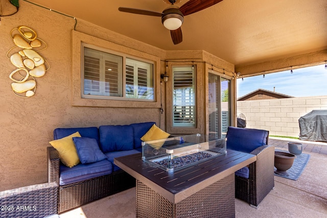 view of patio / terrace featuring an outdoor living space with a fire pit, fence, grilling area, and a ceiling fan