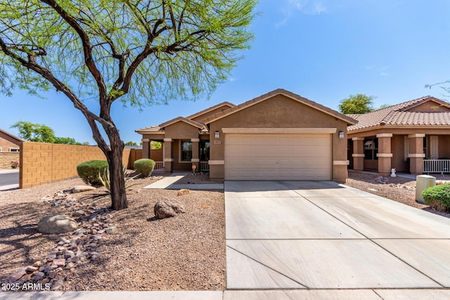 ranch-style home with an attached garage, a tile roof, fence, concrete driveway, and stucco siding