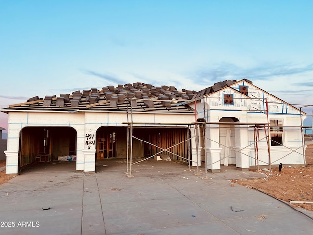 property under construction with a garage