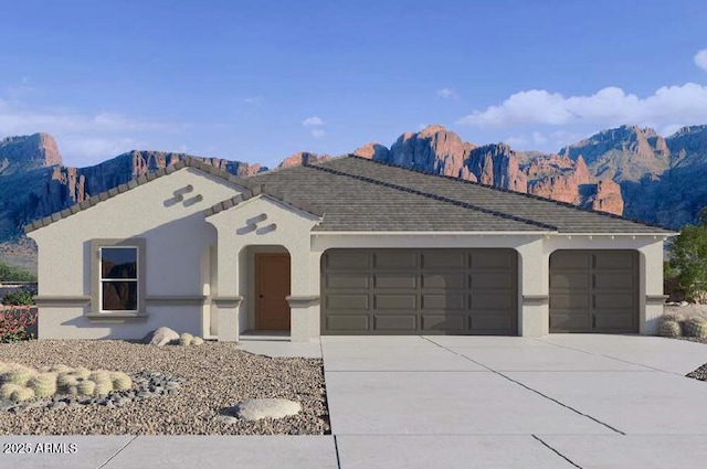 view of front of home featuring a garage and a mountain view