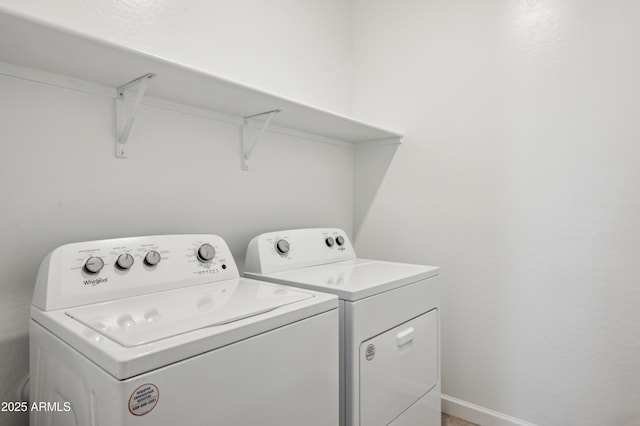 laundry room with independent washer and dryer