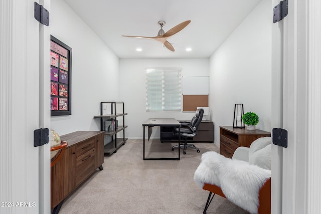 office with light carpet and ceiling fan