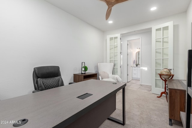 office area with ceiling fan and light colored carpet