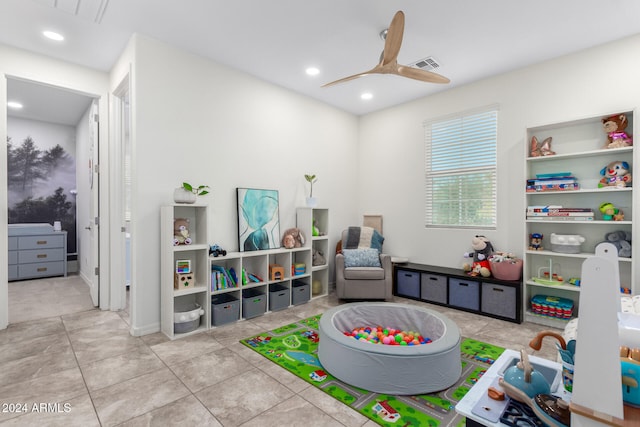 playroom featuring light tile patterned floors and ceiling fan