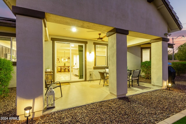 patio terrace at dusk with ceiling fan