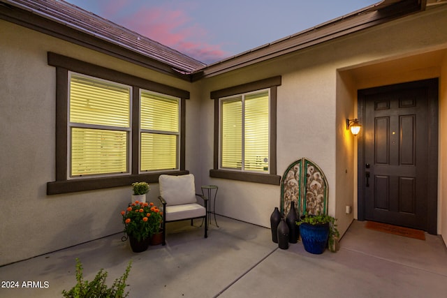 view of patio terrace at dusk