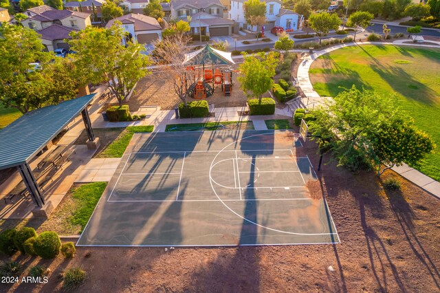 view of basketball court featuring a playground