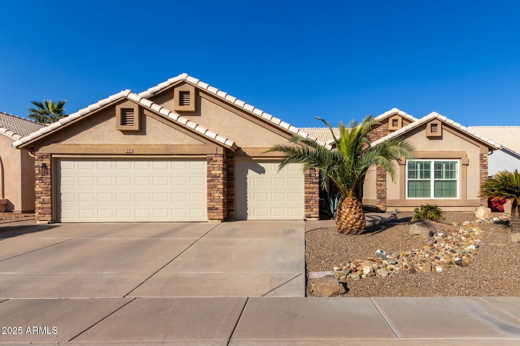 single story home featuring a garage