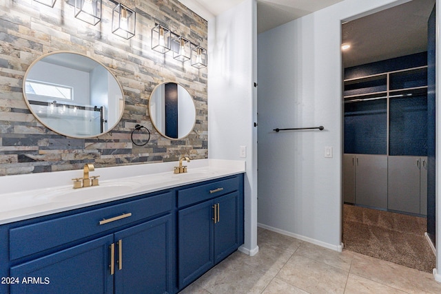 bathroom with tile patterned floors and vanity