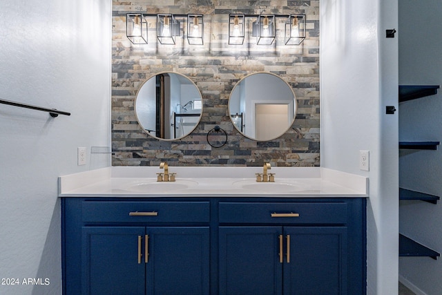 bathroom with vanity and tasteful backsplash