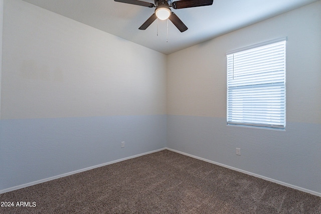 carpeted empty room featuring ceiling fan