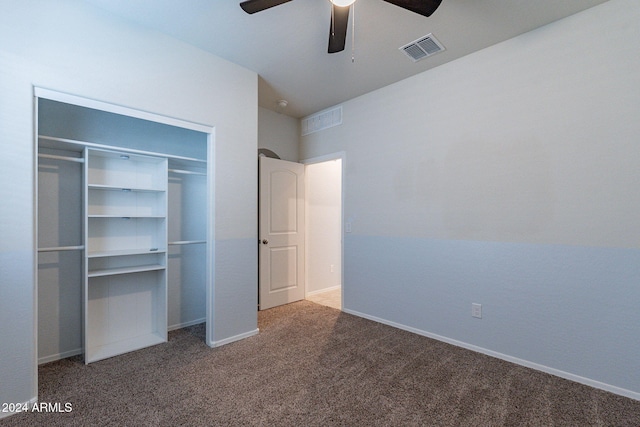 unfurnished bedroom with ceiling fan, a closet, and carpet flooring