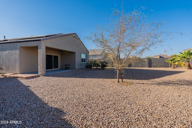 back of property featuring a patio