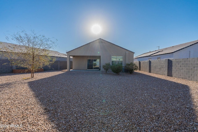 back of house with a patio area