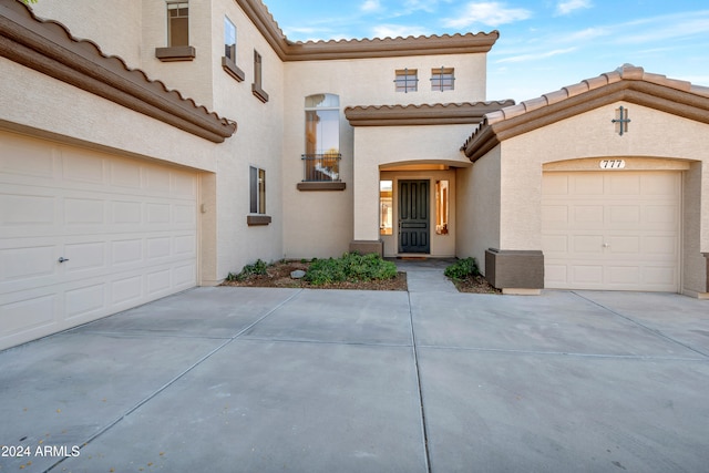 mediterranean / spanish house featuring a garage