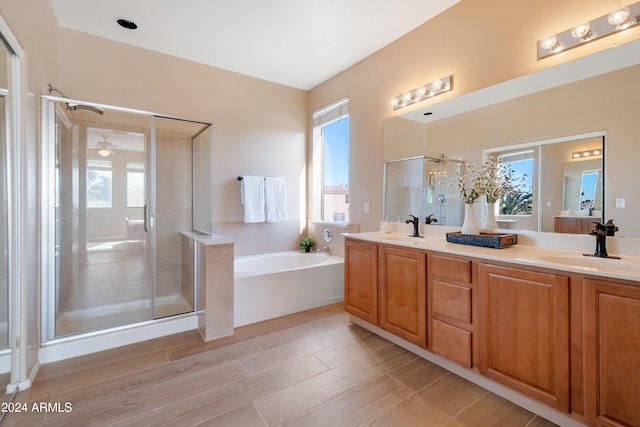 bathroom featuring shower with separate bathtub, vanity, and wood-type flooring