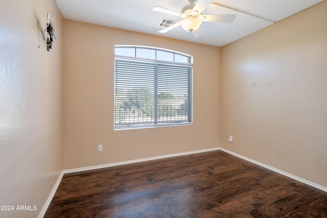 spare room featuring ceiling fan and dark hardwood / wood-style flooring