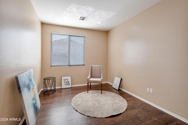 sitting room with dark hardwood / wood-style flooring