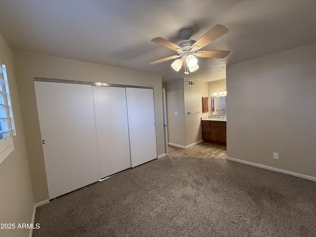 5525 E Thomas Rd Unit C2, Phoenix, AZ 85018 - unfurnished bedroom with light carpet, a closet, a ceiling fan, and ensuite bathroom