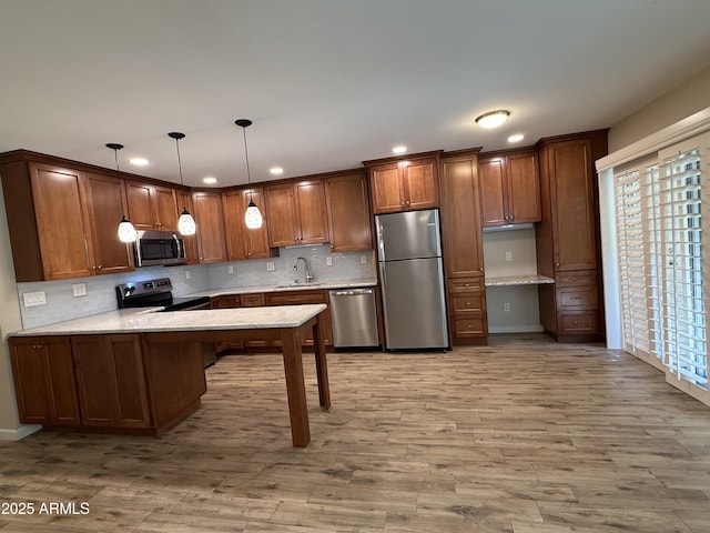 5525 E Thomas Rd Unit C2, Phoenix, AZ 85018 - kitchen with appliances with stainless steel finishes, recessed lighting, built in study area, a peninsula, and tasteful backsplash