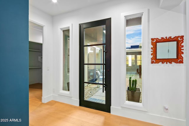 doorway with light hardwood / wood-style floors