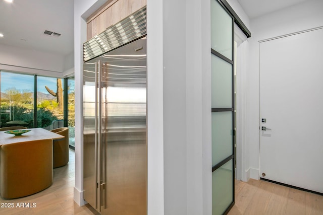 hallway featuring light hardwood / wood-style flooring