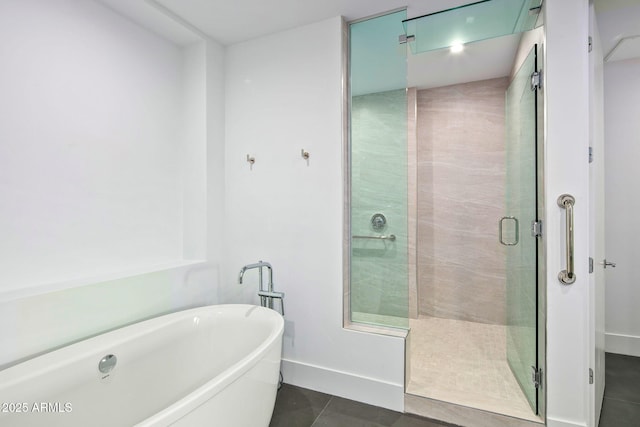 bathroom featuring plus walk in shower and tile patterned floors