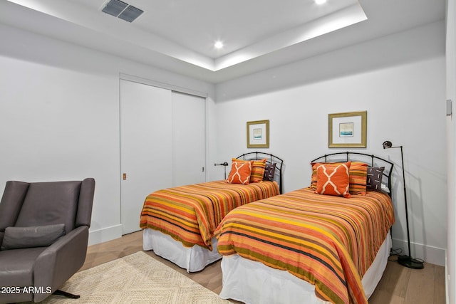 bedroom with a closet and light wood-type flooring