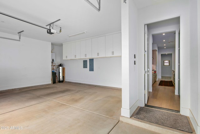 garage featuring a garage door opener and electric panel