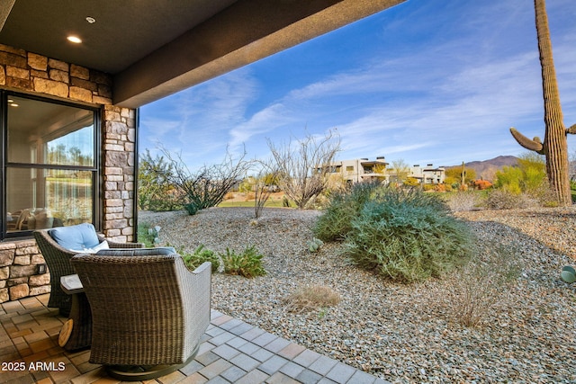 view of patio / terrace with a mountain view