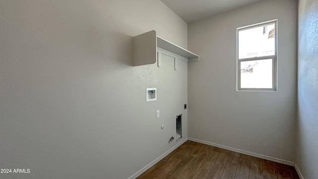 washroom featuring hookup for a washing machine, gas dryer hookup, hardwood / wood-style floors, and hookup for an electric dryer