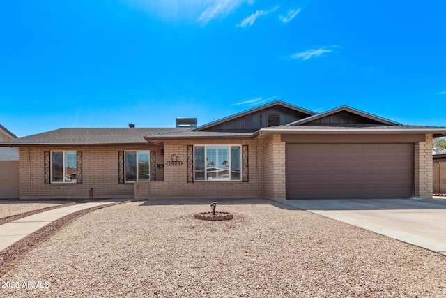 ranch-style home featuring brick siding, concrete driveway, and a garage