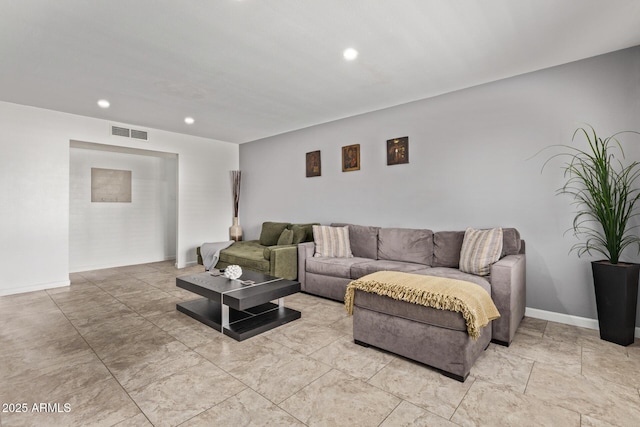 living room with visible vents, recessed lighting, and baseboards