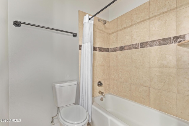 full bathroom featuring shower / tub combo and toilet