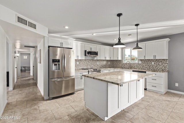 kitchen featuring visible vents, appliances with stainless steel finishes, and white cabinetry