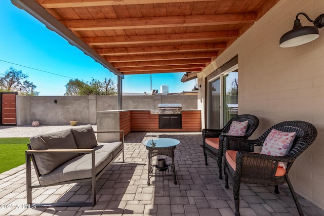 view of patio / terrace featuring area for grilling, outdoor lounge area, and fence