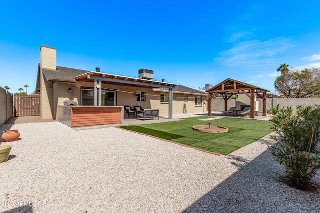 back of house with a gazebo, a patio area, and a fenced backyard