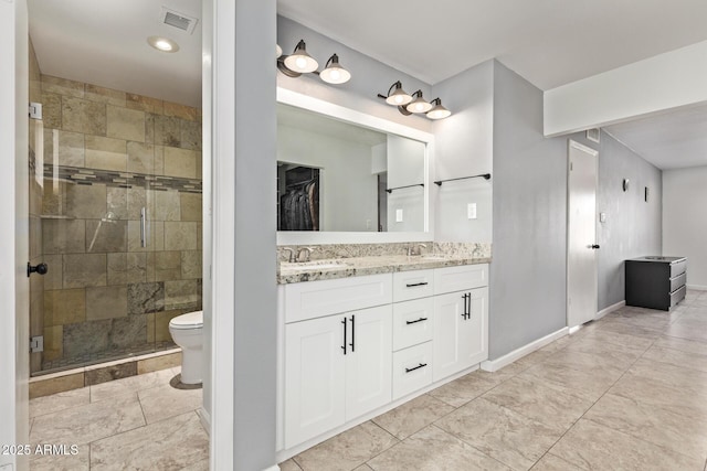 full bathroom featuring visible vents, toilet, a stall shower, a sink, and double vanity