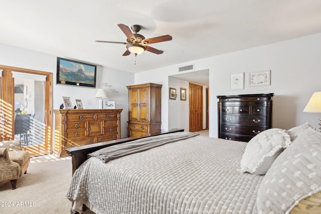 bedroom featuring ceiling fan and light carpet