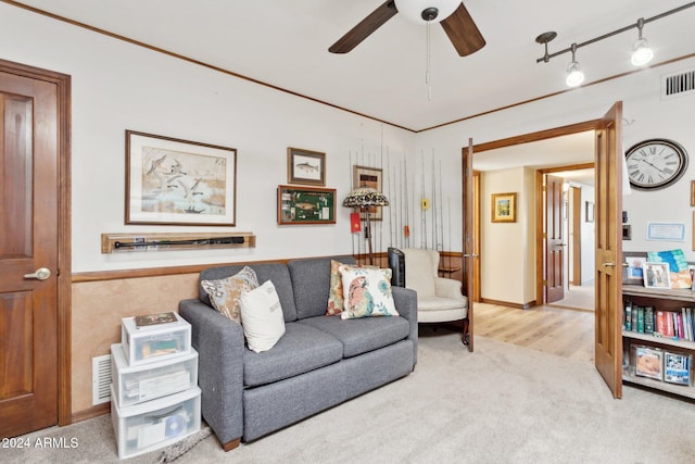 living room with carpet flooring and ceiling fan