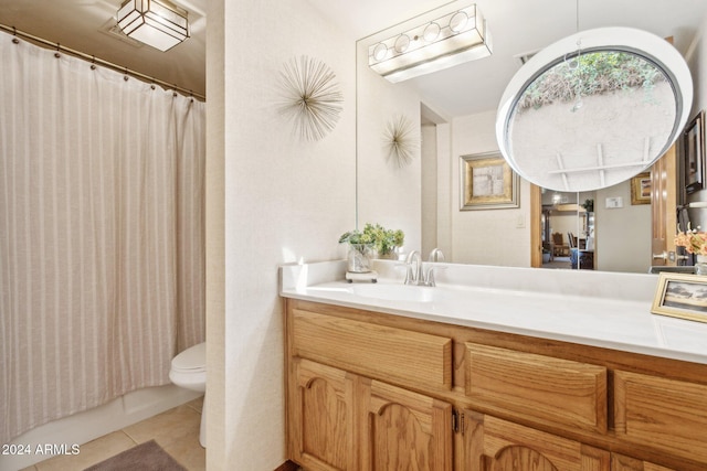 bathroom with tile patterned floors, vanity, and toilet