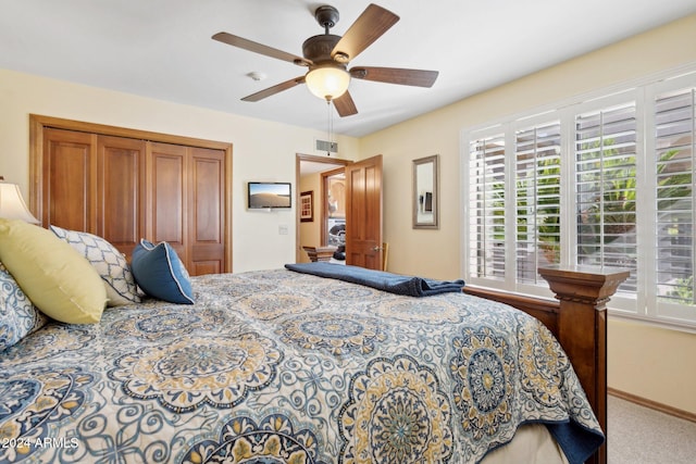 bedroom featuring carpet flooring, a closet, multiple windows, and ceiling fan