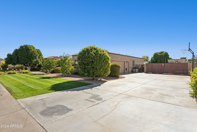 exterior space featuring a lawn and a garage