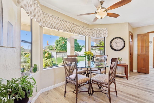 dining space featuring ceiling fan and light hardwood / wood-style floors