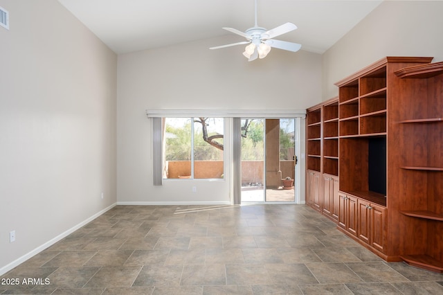 unfurnished living room featuring ceiling fan and high vaulted ceiling