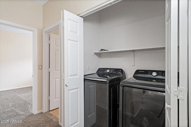 laundry room with laundry area, independent washer and dryer, baseboards, and carpet