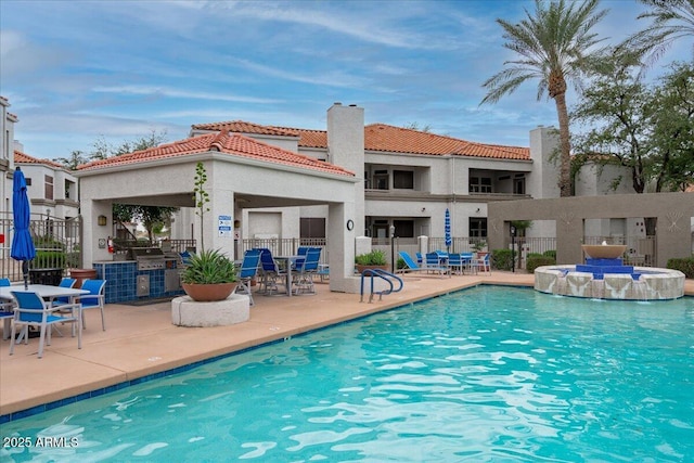 pool featuring a patio area and fence