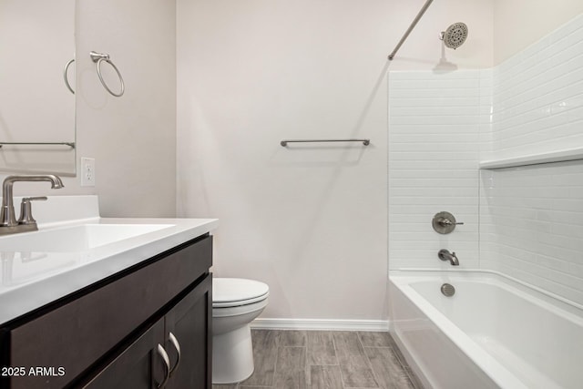 full bathroom featuring bathing tub / shower combination, vanity, and toilet