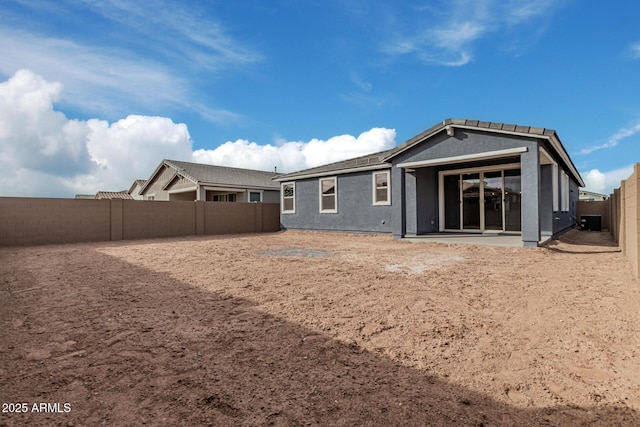 back of property featuring a patio area