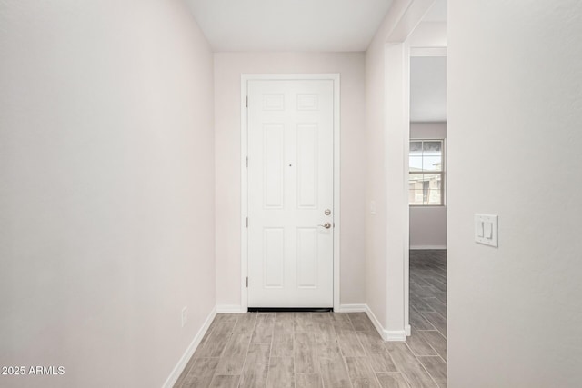 hall with light hardwood / wood-style flooring